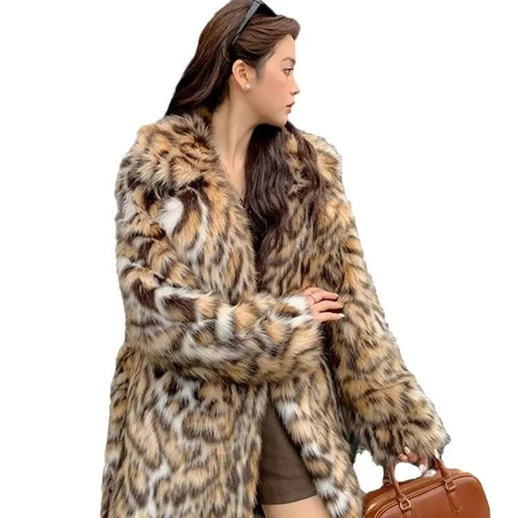 A women's long faux fur coat with a fur collar and pockets, shown in a street fashion style.