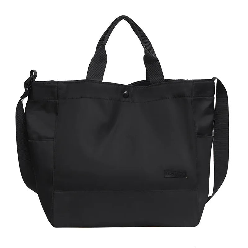 Large capacity nylon crossbody bag for women, black colour, soft material, with three shoulder straps