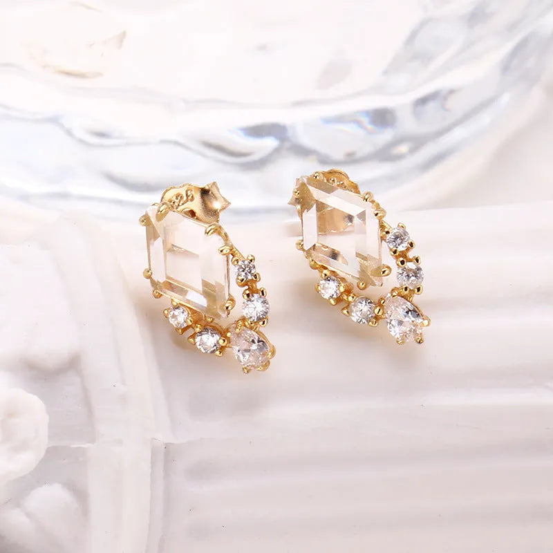 Geometric silver earrings with white crystal studs on 925 silver backing