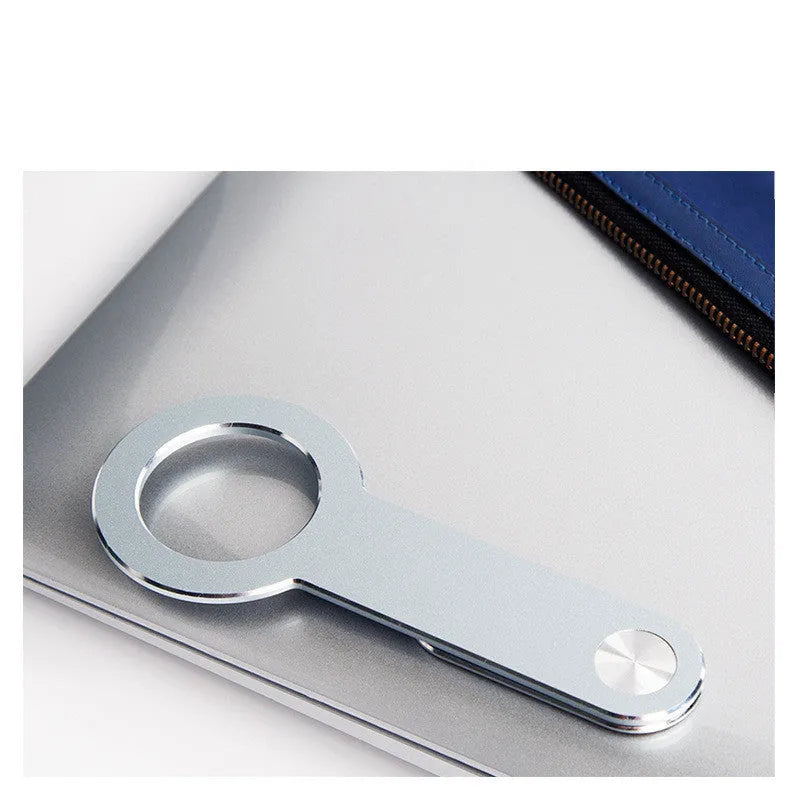 Metallic silver aluminium alloy desktop phone holder with magnetic extension for iPhone.