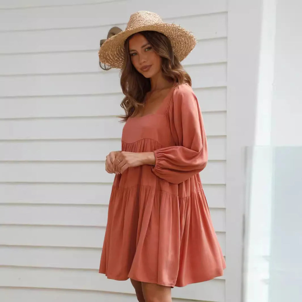 Orange backless children's dress with square collar, puff sleeves, and an A-line skirt.