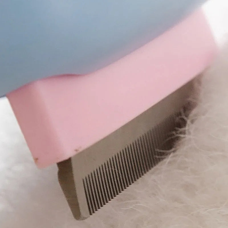 Blue and green double-sided pet grooming brush with dematting comb and undercoat rake on a 195mm handle.