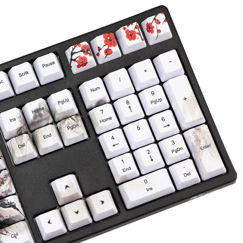 Set of 109 PBT keycaps with plum blossom design on a black background, showing Japanese legend style.