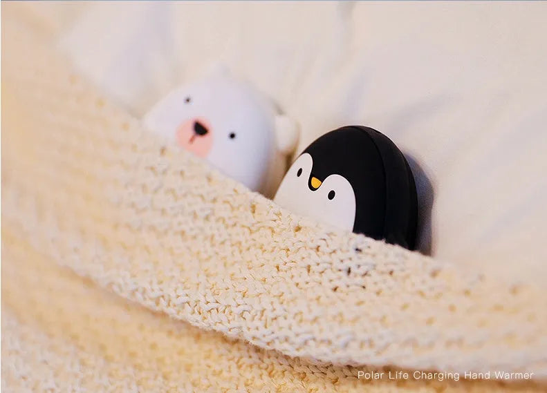 Cute cartoon penguin and polar bear design USB rechargeable hand warmer and power bank unit.