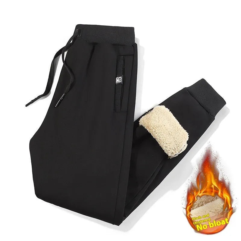 Men's grey fleece-lined cotton track pants with oversized fit and micro elastic waist.