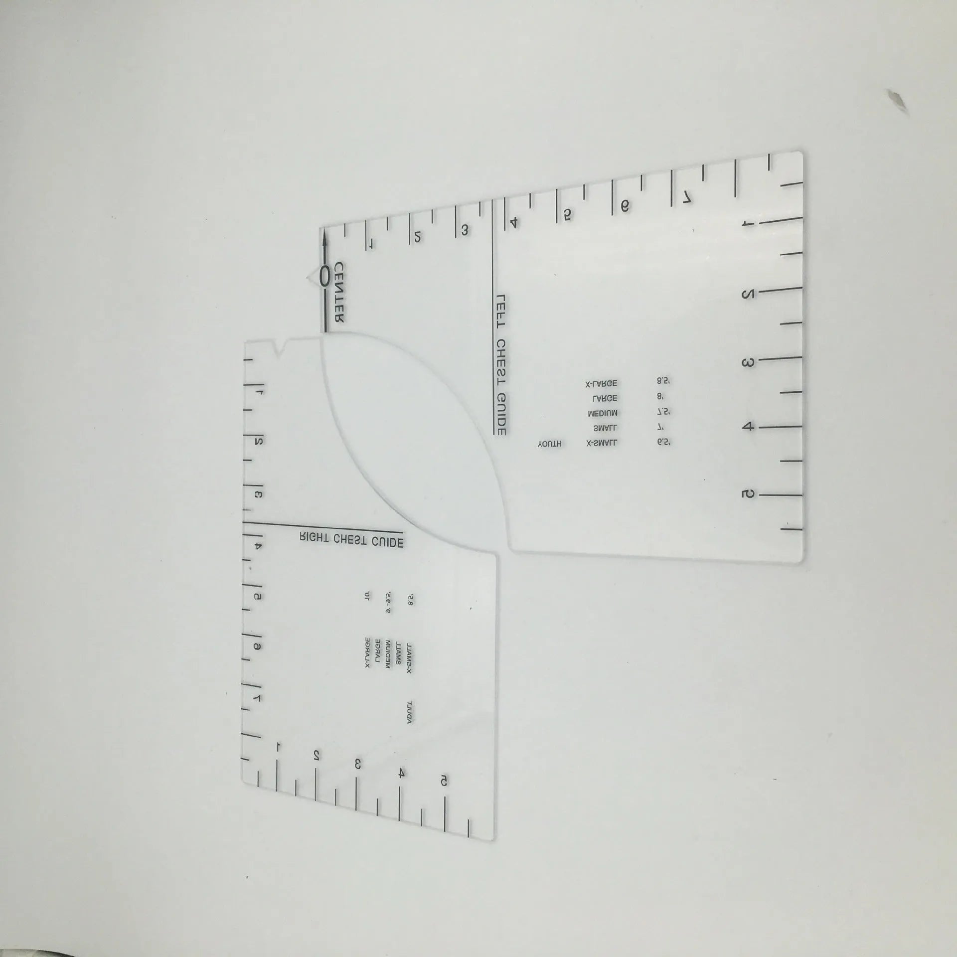 Clear acrylic sewing patch ruler for T-shirt alignment, 10 by 6 inches.