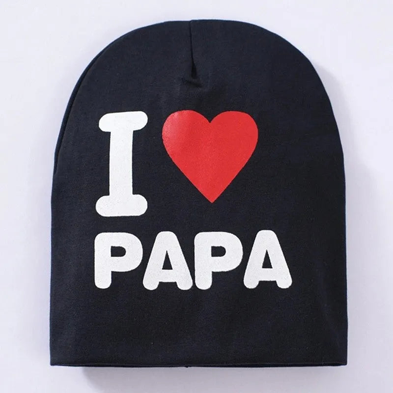 Baby hat in grey with 'Love Mama' text print, showing soft cotton-Lycra knit fabric