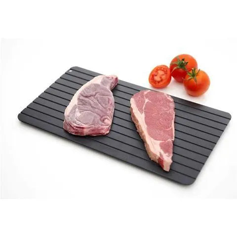 Black aluminium quick defrosting tray for thawing frozen meat and food without electricity.
