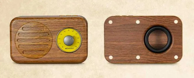 Compact portable Bluetooth speaker in wood colour finish with FM radio and USB cable.