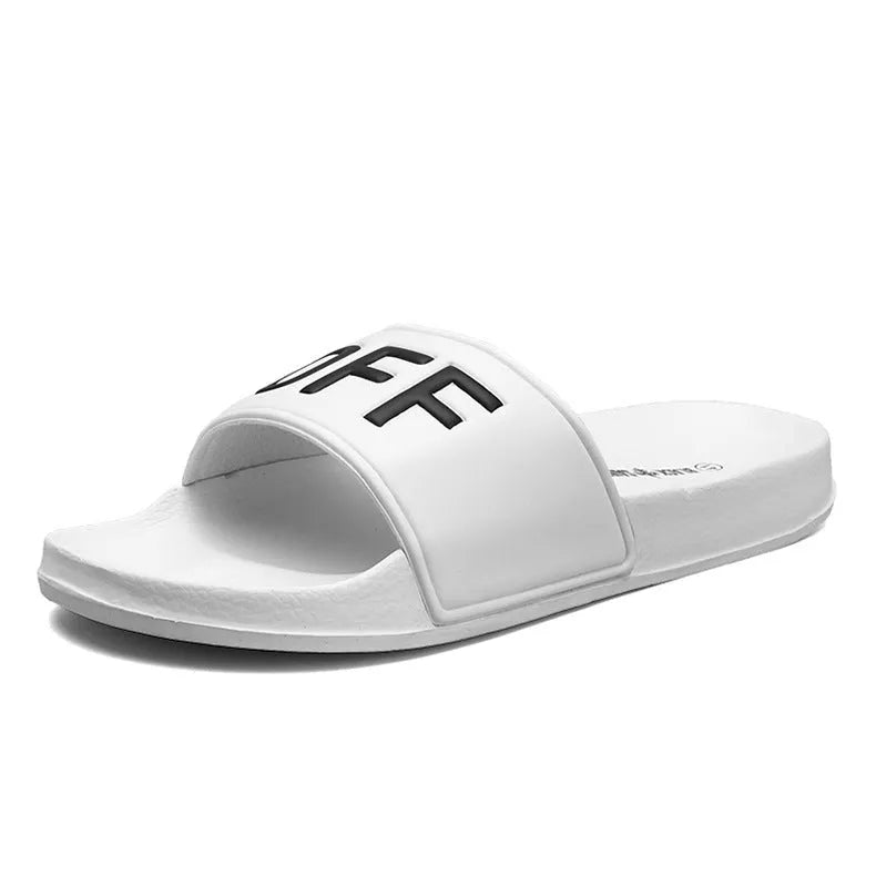 Men's large black and white open toe slippers with a rubber sole on a plain background.
