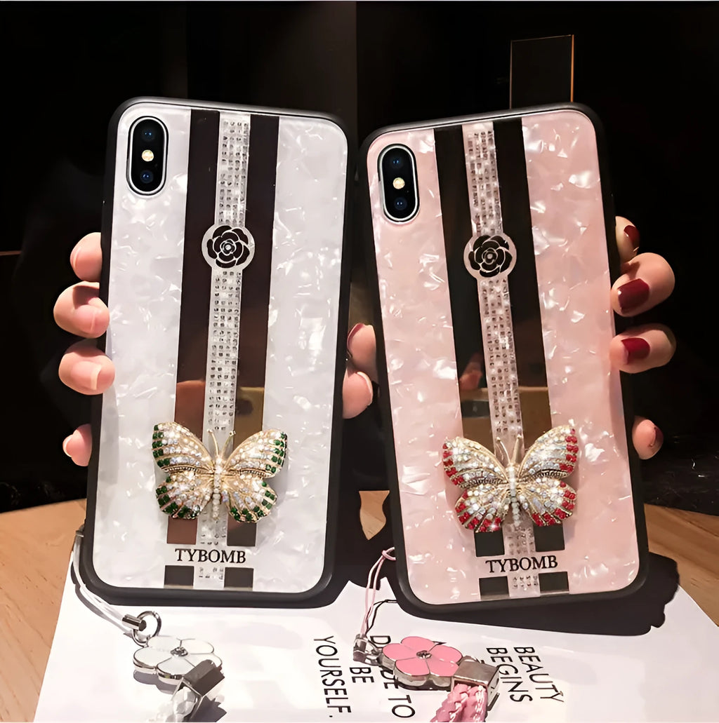 Luxury acrylic iPhone case with butterfly and diamond crystal design and a mirrored back in purple colour.