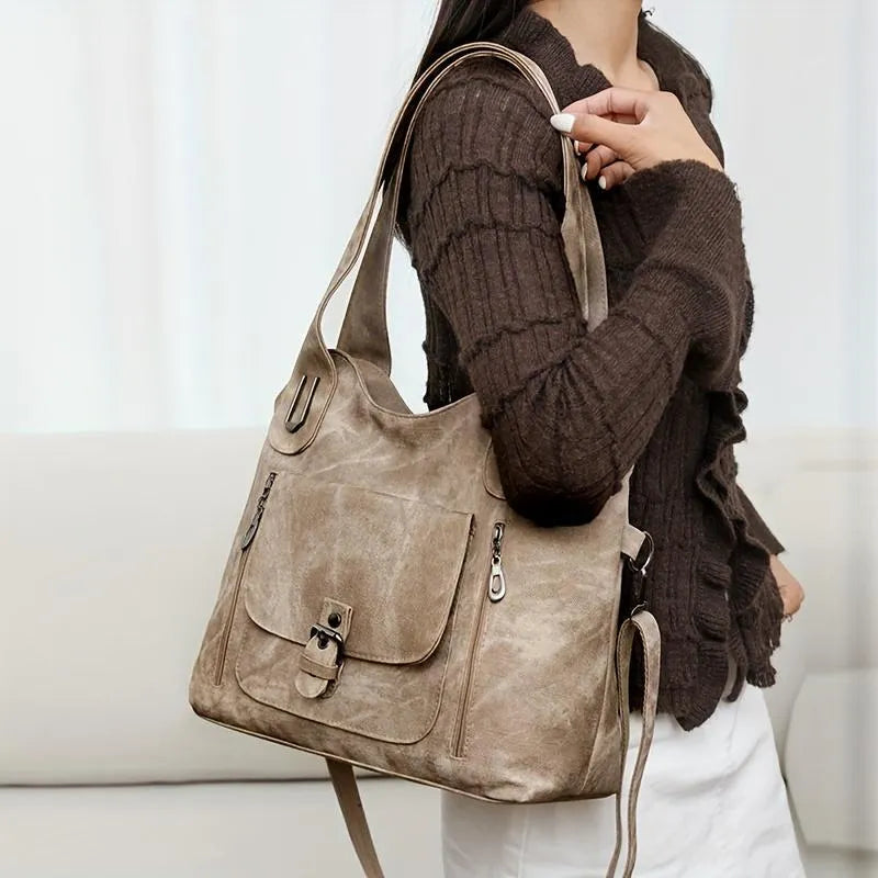Soft synthetic leather handbag with metal accent in vintage style, colour example shown