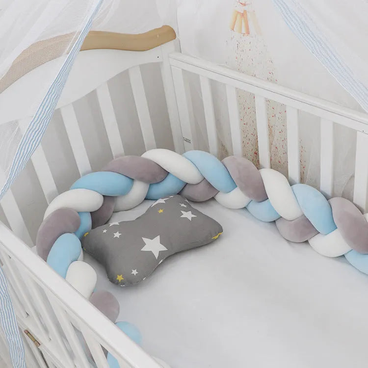 Spandex crystal velvet baby cot bumper in grey pink colour, shown flexible and long.