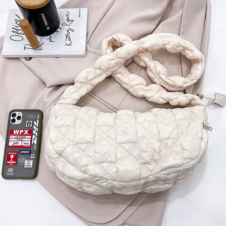 Women's nylon messenger bag in solid colour with adjustable shoulder strap, shown in beige