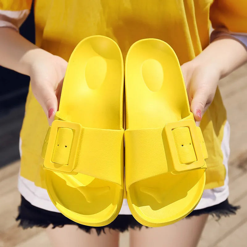 Grey blue women's flip-flop slippers with a single buckle on a soft EVA sole.