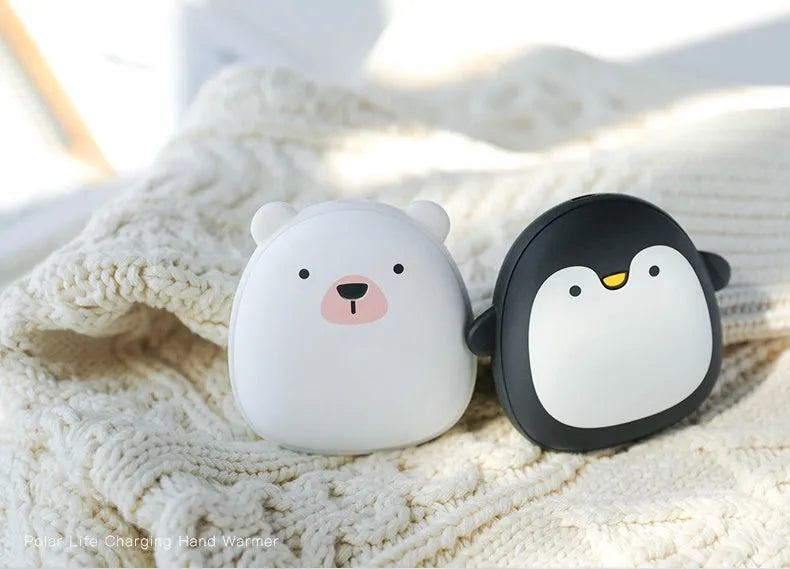 Cute cartoon penguin and polar bear design USB rechargeable hand warmer and power bank unit.