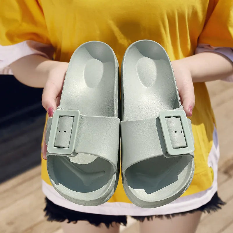 Grey blue women's flip-flop slippers with a single buckle on a soft EVA sole.