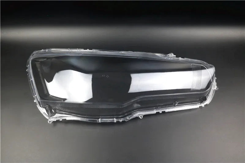 Transparent plastic car headlight housing cover showing 50mm by 30mm dimensions