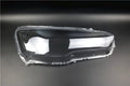 Transparent plastic car headlight housing cover showing 50mm by 30mm dimensions