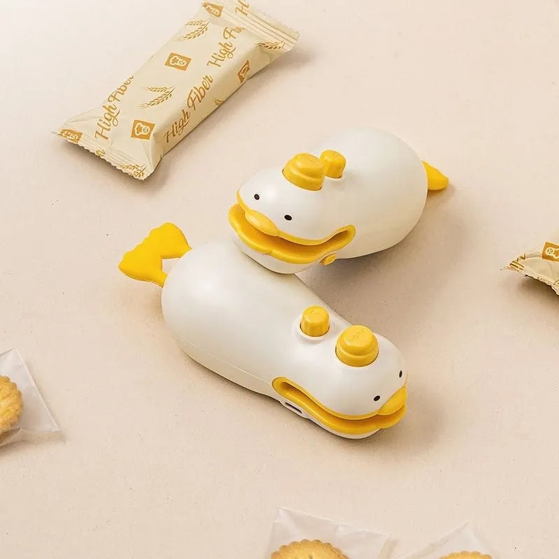 Small yellow duck-shaped rechargeable heat sealing machine with charging cable