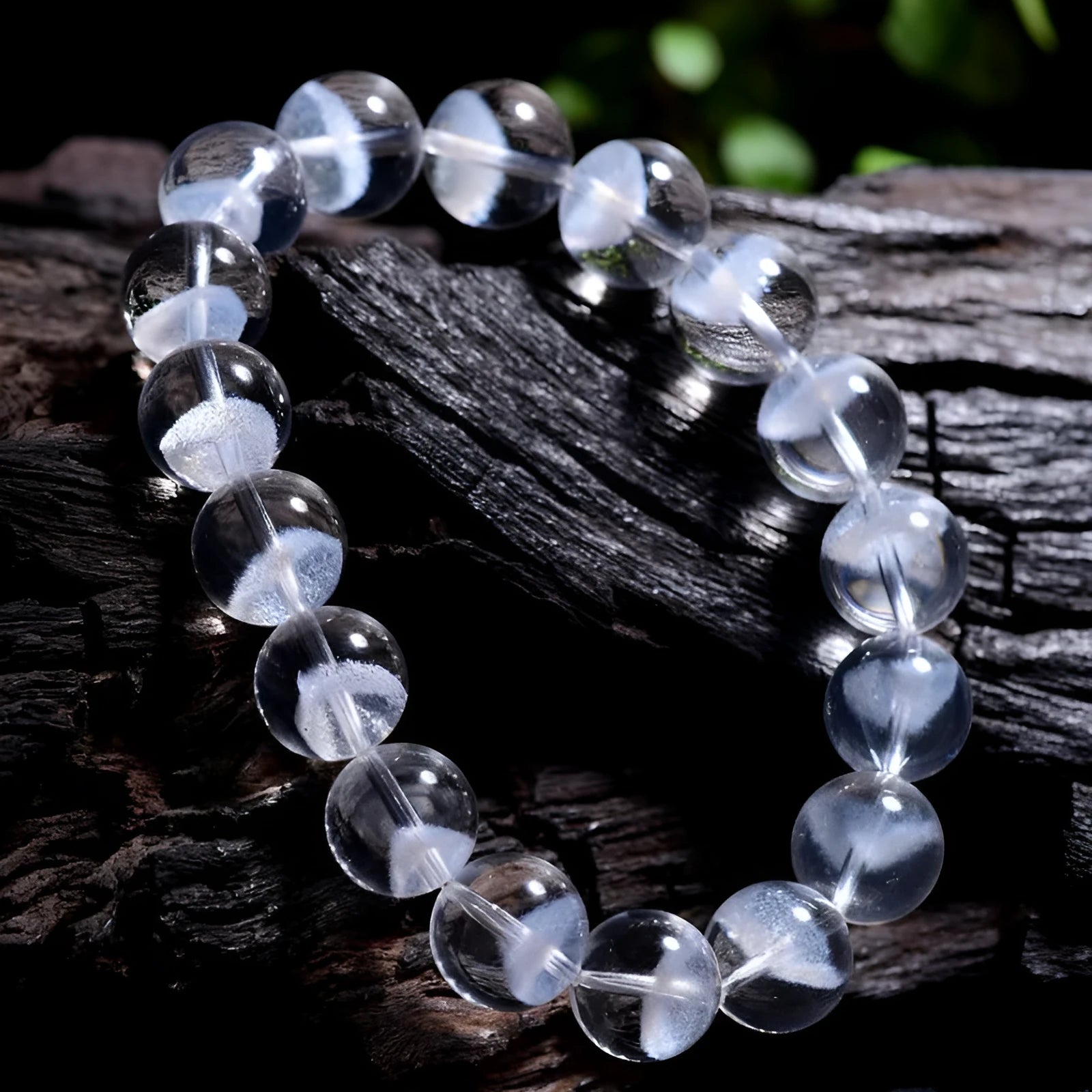 Women's white crystal ghost bracelet with a ruyi element, showing adjustable bead sizes.
