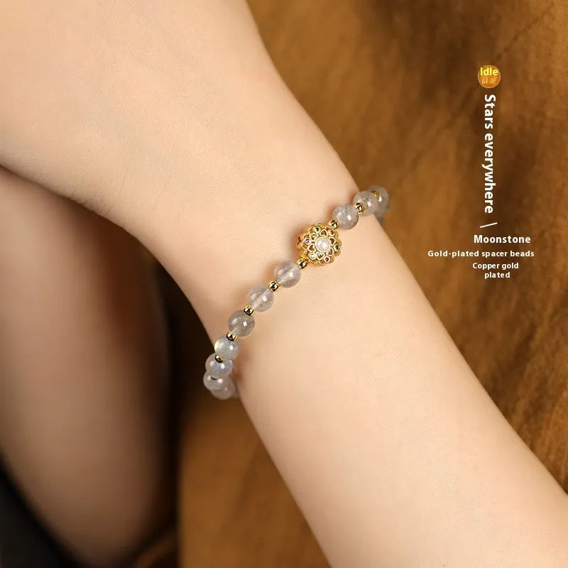Hand-woven gray moonstone crystal bracelet with pink sunstone and peach strawberry quartz beads