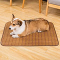 Brown rattan fibre cooling mat for dogs on a wooden floor.