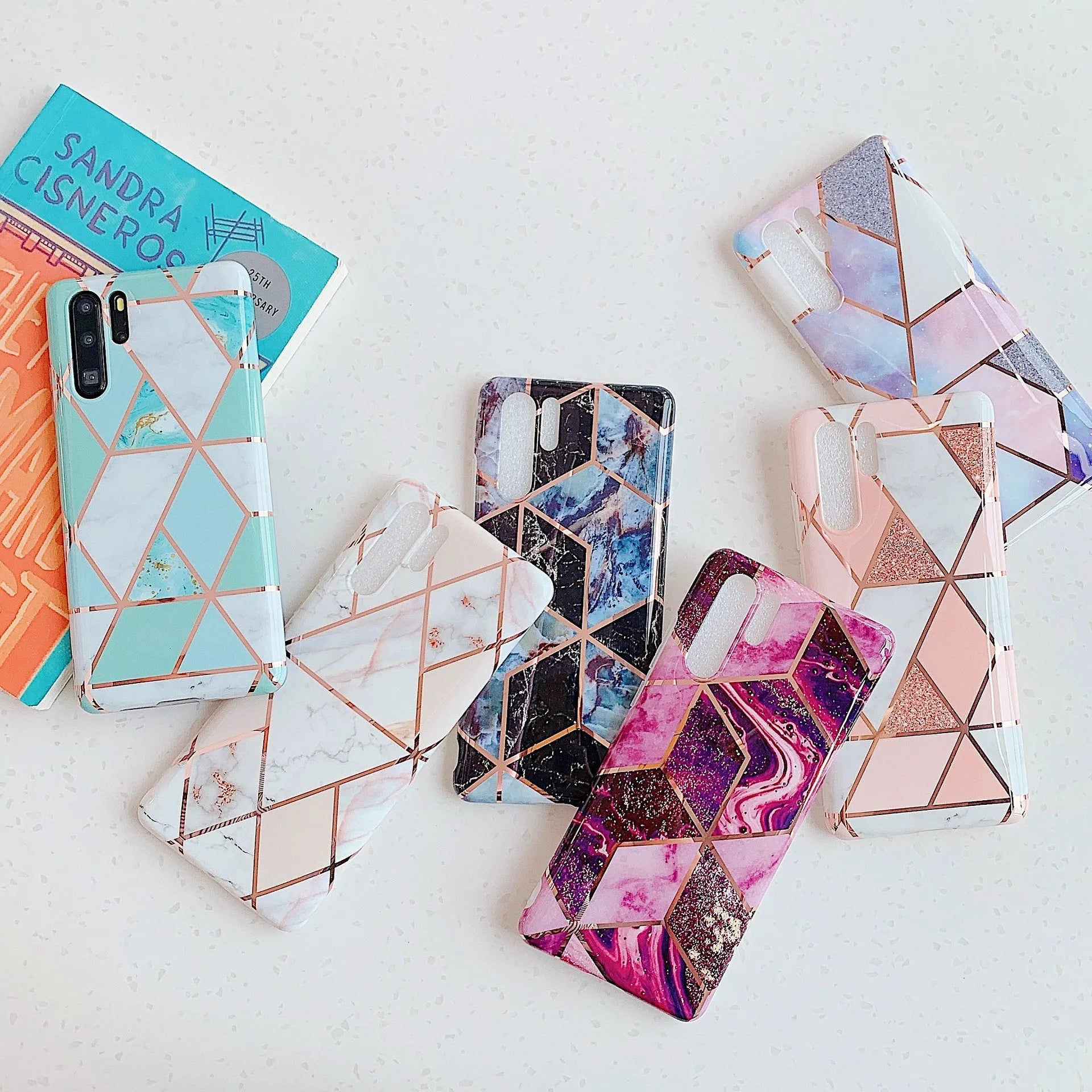 Electroplated marble pattern TPU phone case for Huawei and Samsung smartphones in various colours.
