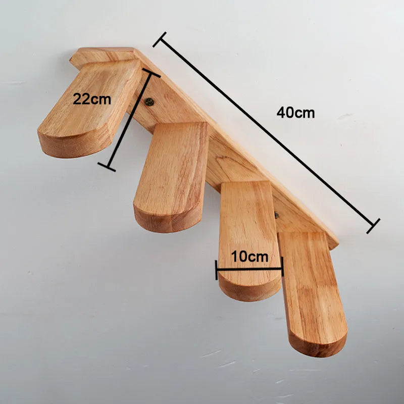 Wall-mounted solid wood cat stairs with 4 steps, left-to-right arrangement, on a white wall