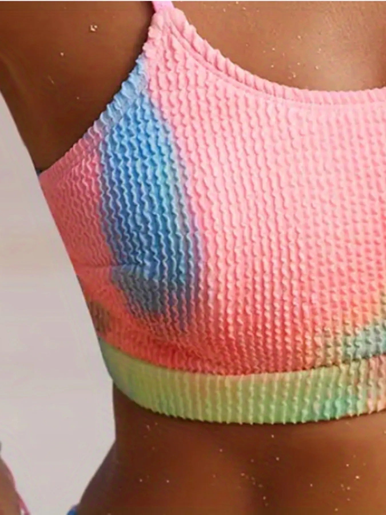 Women's orange and blue tie-dye pleated split bikini swimsuit with gradient pattern