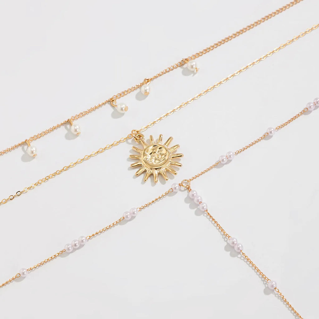 Long Y-shaped tassel pendant twin necklace in imitation pearl with gold electroplated finish on woman