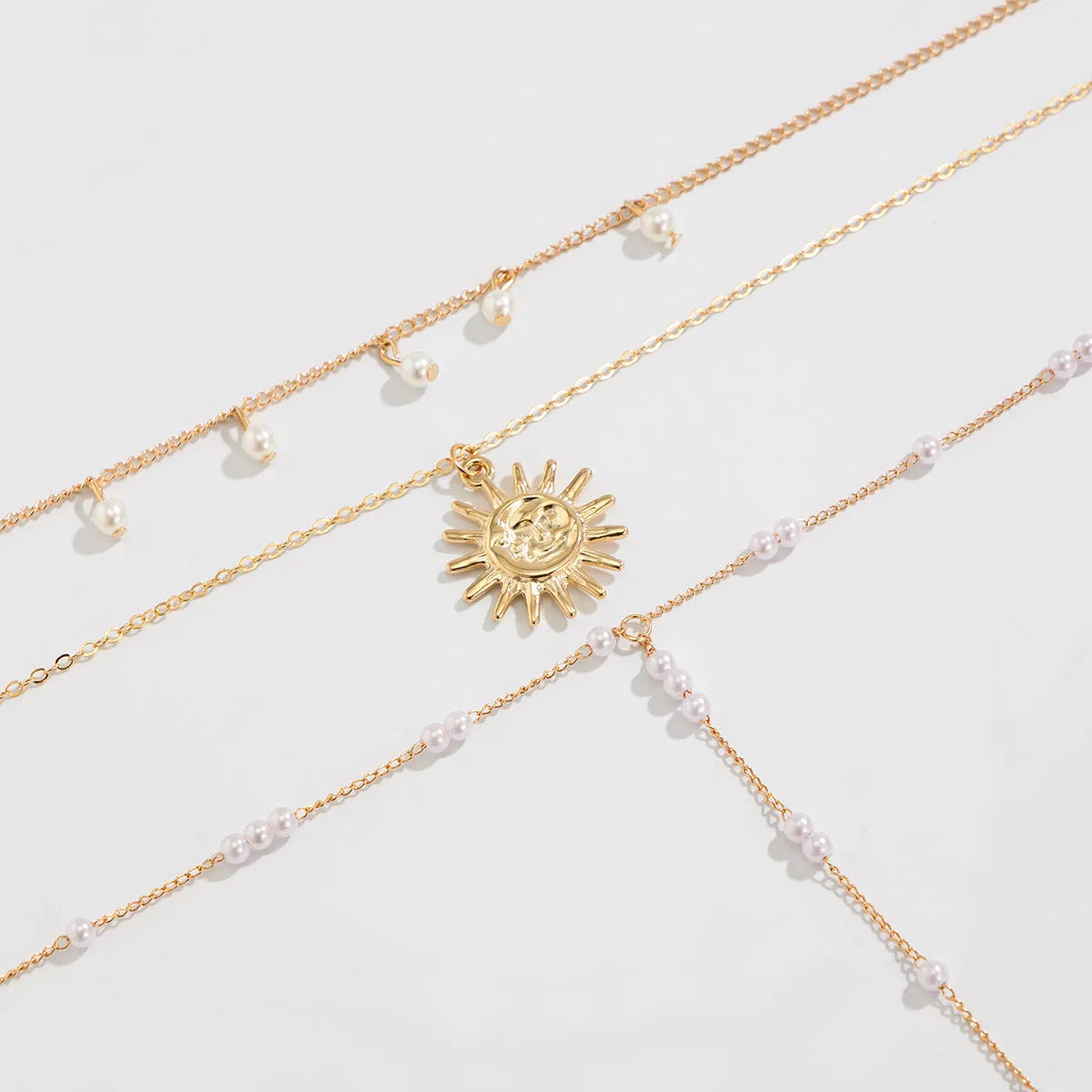 Long Y-shaped tassel pendant twin necklace in imitation pearl with gold electroplated finish on woman