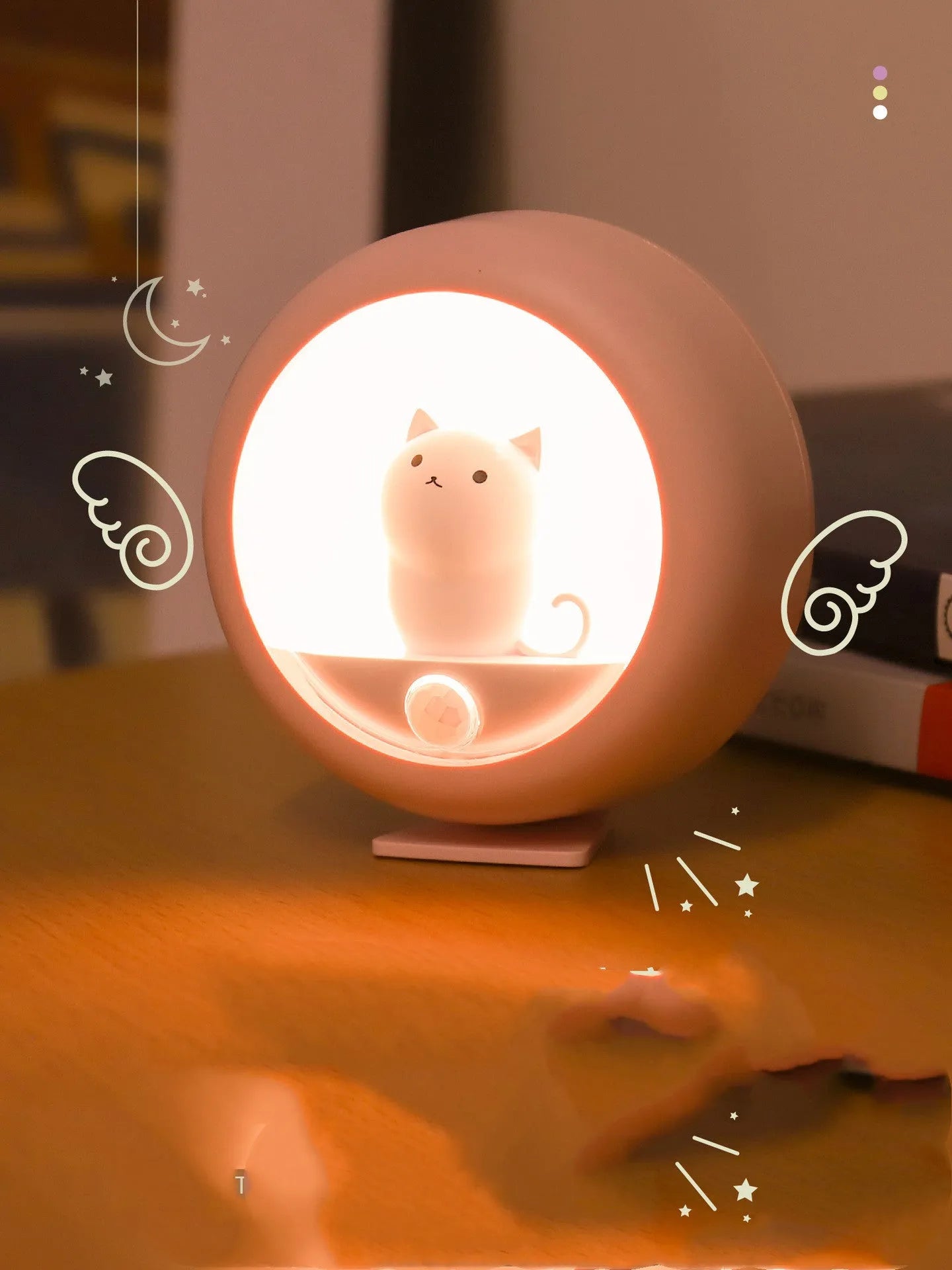 Baby bedside sleep lamp showing orange, pink, and white light options with a projection feature.