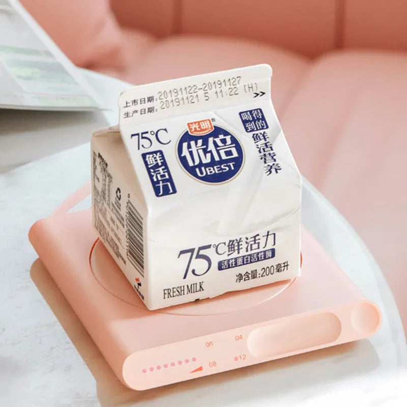Pink USB heating cup pad with touch controls and automatic timer function