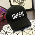 Black printed baseball cap with King design on front, adjustable back strap, on white background