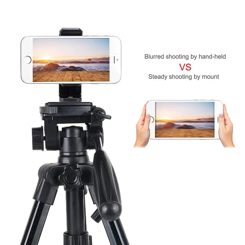 Black plastic single phone holder with rotating clamp on a wooden desk.