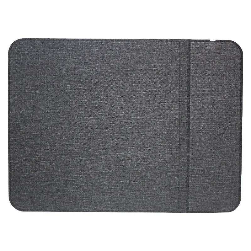 Grey foldable cloth phone holder with wireless charging stand on a desk