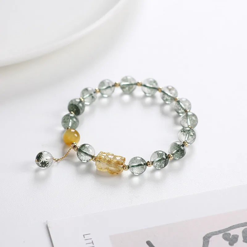 Green phantom quartz crystal bracelet with 8mm beads and gold accents in geometric ethnic style