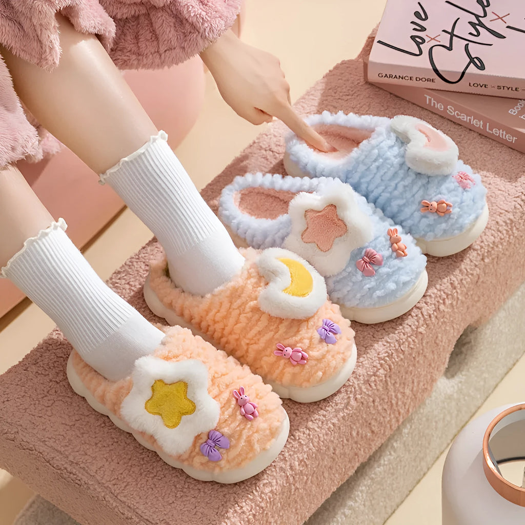 Women's light blue fleece-lined plush home slippers with round heel and PVC sole.