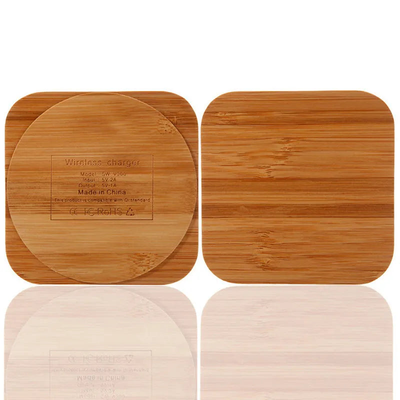 Square bamboo wood 5W wireless charger on a wooden surface.