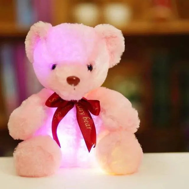 Plush teddy bear with glow feature in brown colour, sitting at 25 cm height
