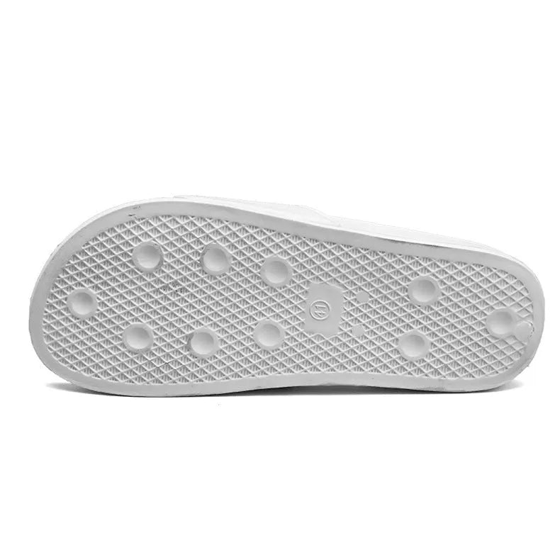 Men's large black and white open toe slippers with a rubber sole on a plain background.