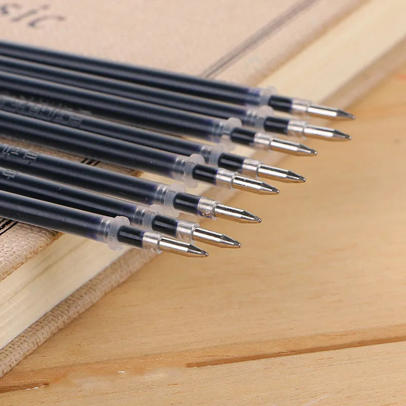 Automatic fade and disappear pen set showing pen holder, case, and eight refill cartridges of vanishing ink