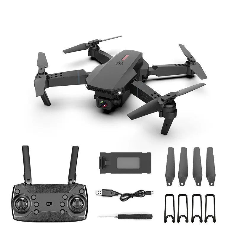 Grey foldable 4K dual camera drone with remote controller on a table.