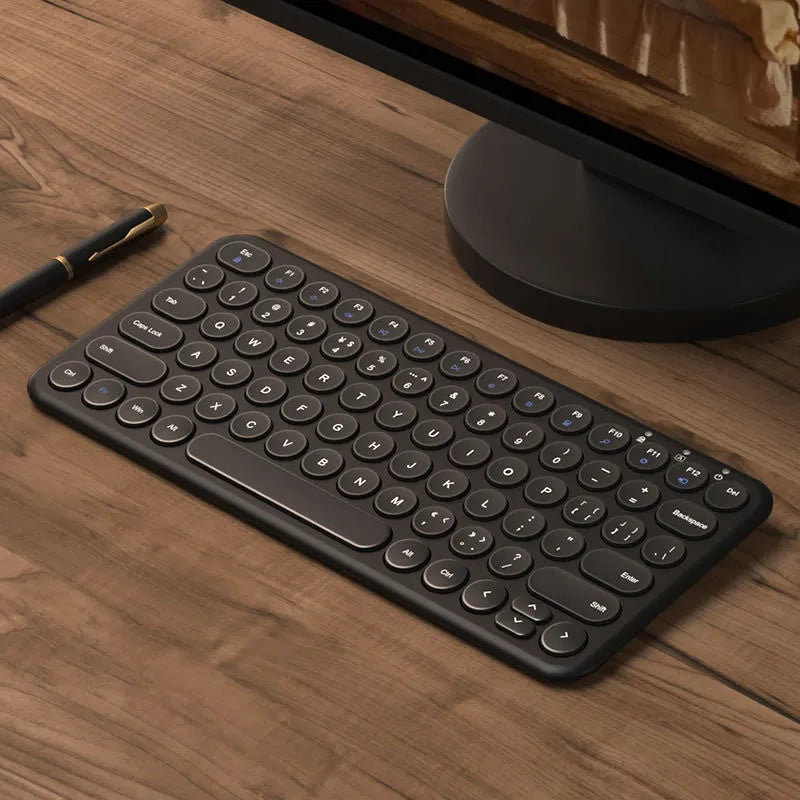 Ultra-thin wireless keyboard and mouse set in white with USB receiver and keyboard film.
