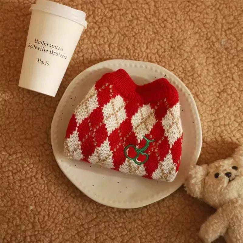 Red cat sweater with rhombic embroidery cherry design showing front view with size label
