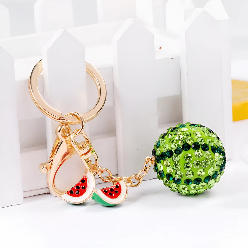 Green watermelon-shaped zinc alloy keychain with decorative accents, shown on a key ring.