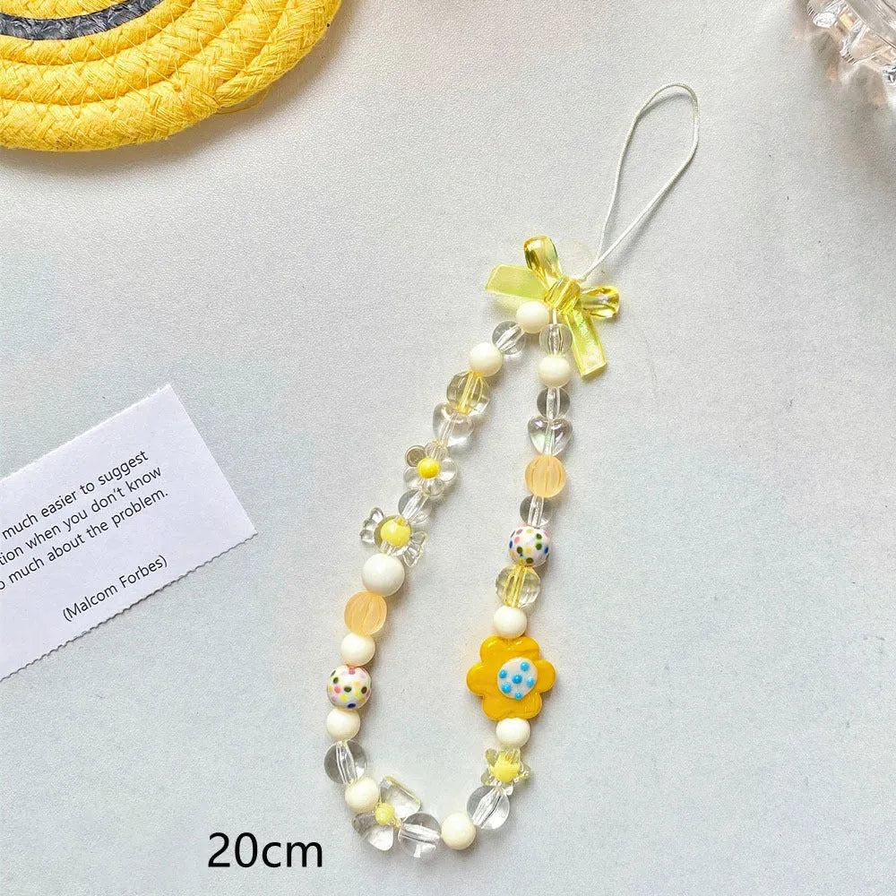 Blue floral beaded mobile phone lanyard with an adjustable hand rope.