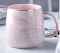 Ceramic mug with marble pattern, 320ml capacity, grey colour, on a table