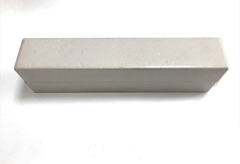 Black wall-mounted BS-41 Bluetooth speaker with remote control on a white wall.